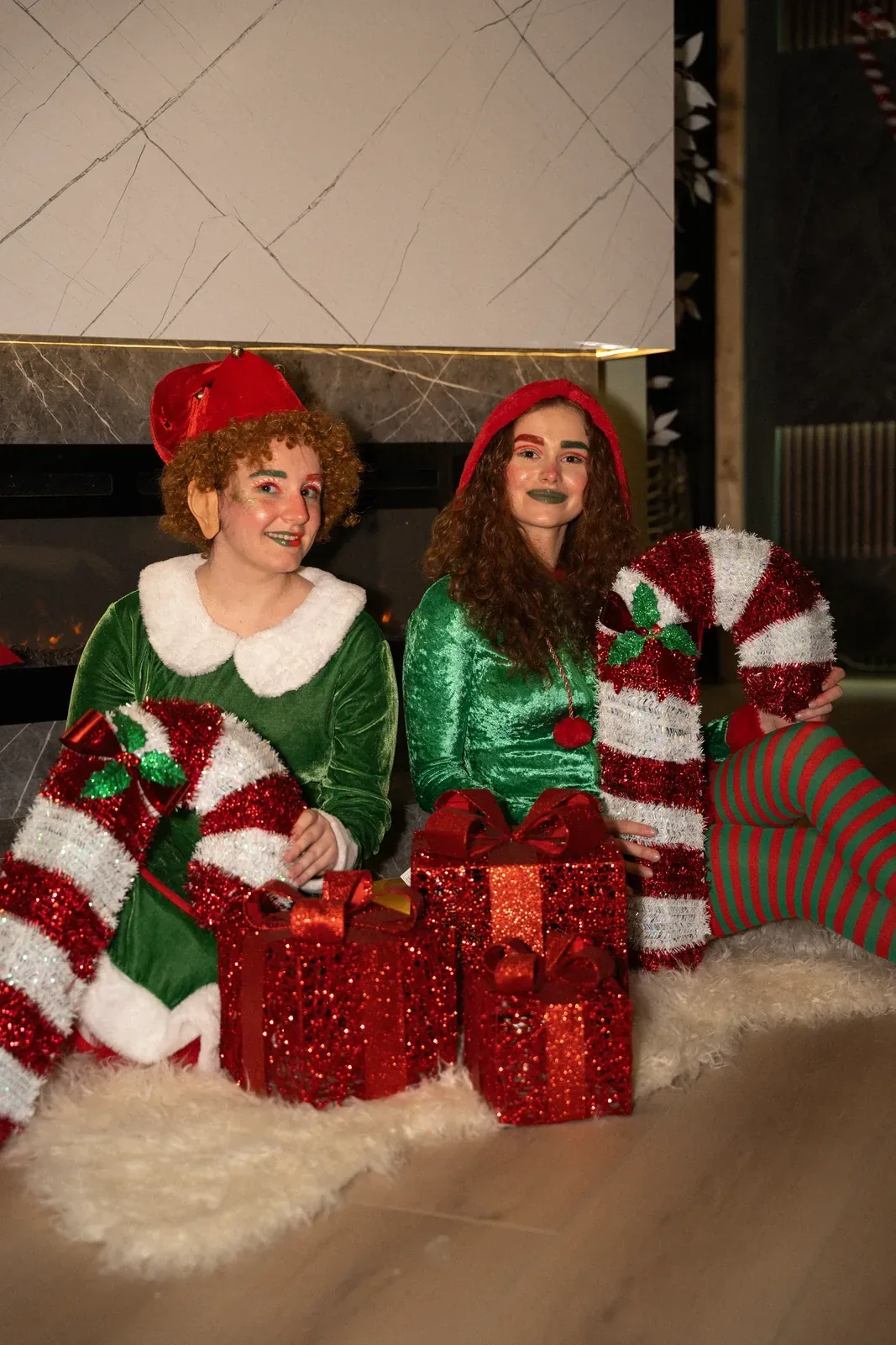 Two Christmas elves with candy canes