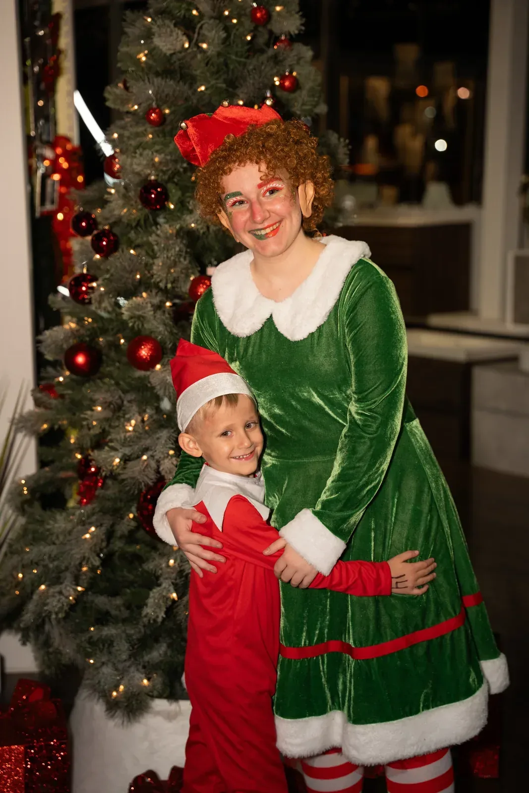 Christmas elf with a child in elf costume