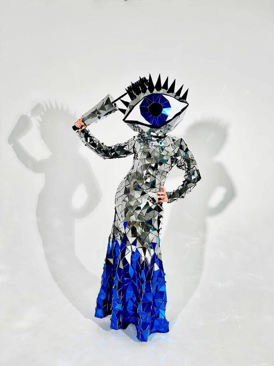 Mirror Eye performer with a giant sparkling eye head