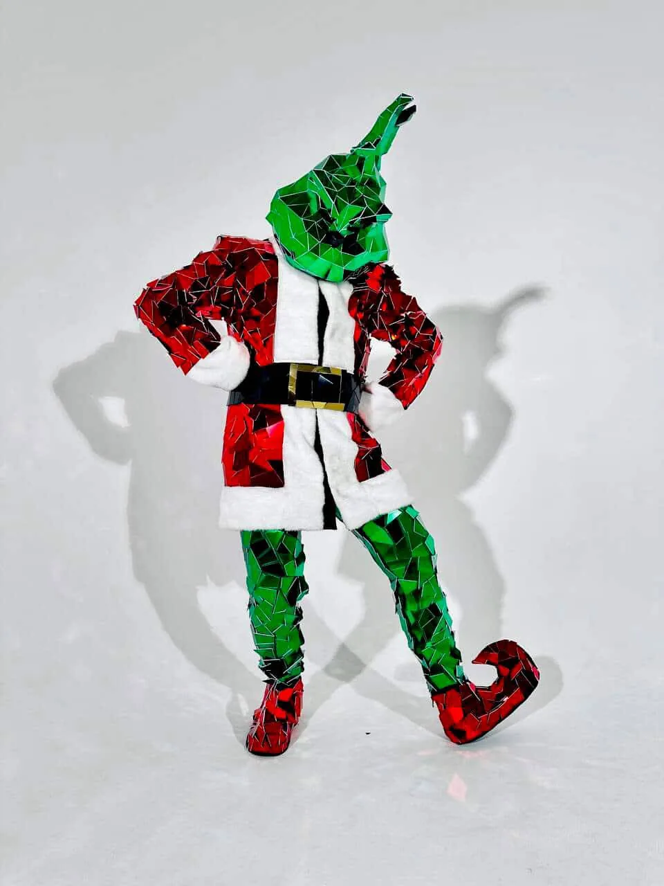 Mirror Grinch in a sparkling mosaic Santa suit