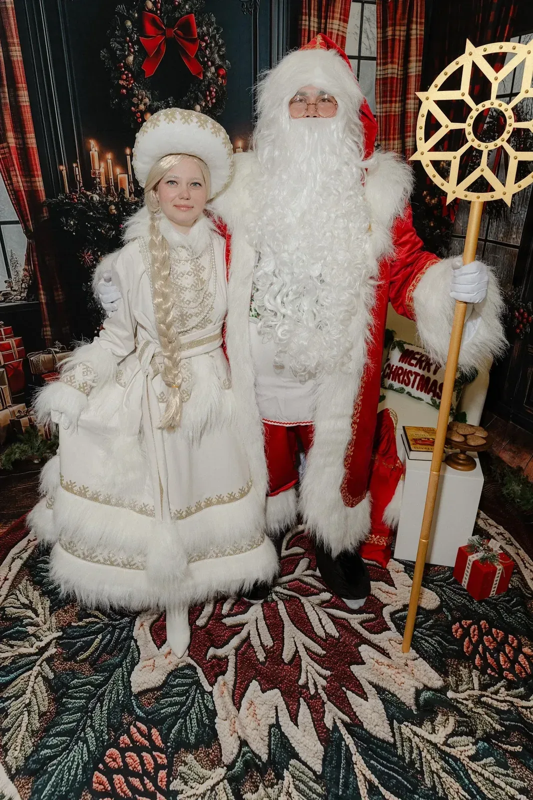 Santa Claus with Snow Maiden at a holiday party