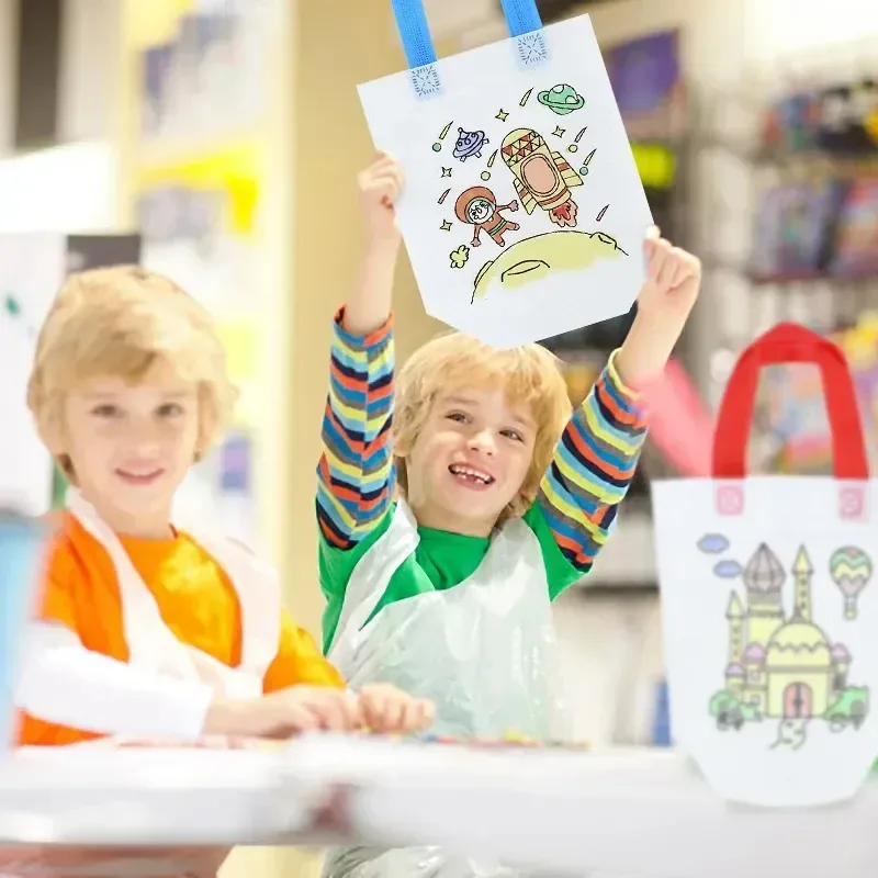 Boy proudly holding hand-painted bag with rocket design